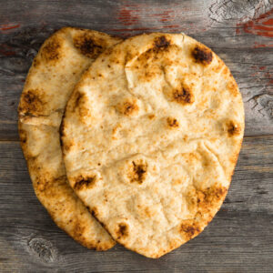Simply delicious baked naan flatbreads on Picnic Table